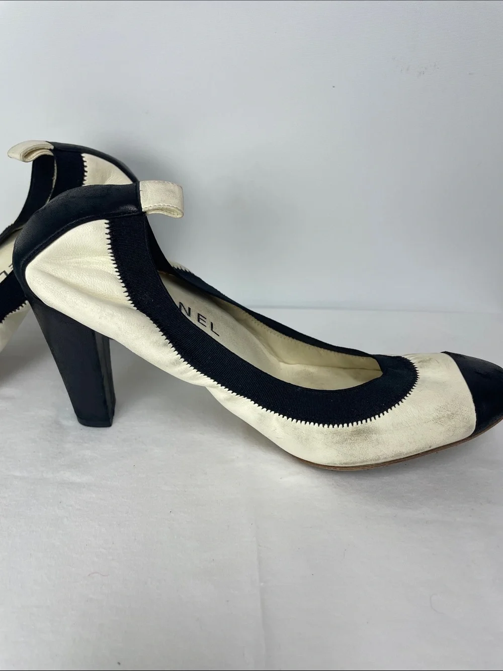 CHANEL Black & White Cap-Toe Leather Pumps